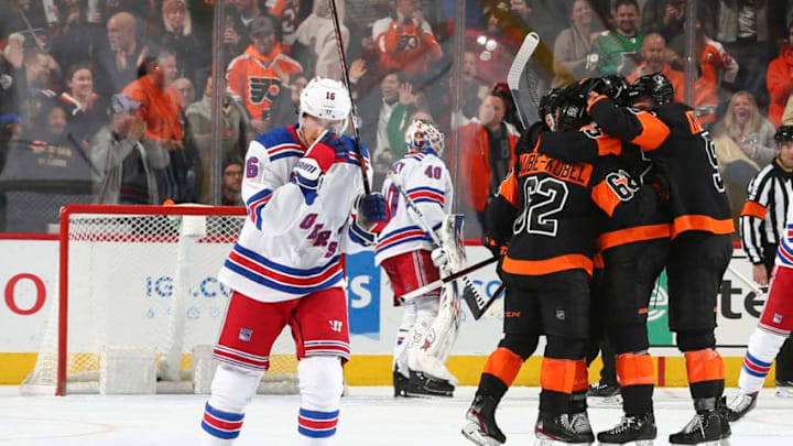 PHILADELPHIA, PA - FEBRUARY 28: Ryan Strome #16 of the New York Rangers skates back to the bench as Nicolas Aube-Kubel #62, James van Riemsdyk #25, and Philippe Myers #5 of the Philadelphia Flyers celebrate a goal by James van Riemsdyk in the second period at the Wells Fargo Center on February 28, 2020 in Philadelphia, Pennsylvania. (Photo by Mitchell Leff/Getty Images)