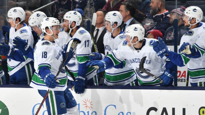 COLUMBUS, OH - DECEMBER 11: Jake Virtanen #18 of the Vancouver Canucks high-fives his teammates after scoring a goal during the third period of a game against the Columbus Blue Jackets on December 11, 2018 at Nationwide Arena in Columbus, Ohio. (Photo by Jamie Sabau/NHLI via Getty Images)