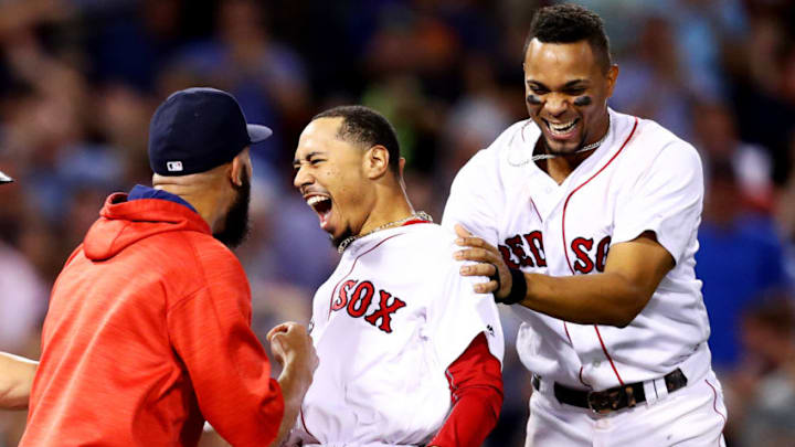 BOSTON, MA - AUGUST 16: Mookie Betts #50 of the Boston Red Sox celebrates with David Price #24 and Xander Bogaerts #2 after hitting a go ahead two run double to defeat the St. Louis Cardinals 5-4 at Fenway Park on August 16, 2017 in Boston, Massachusetts. (Photo by Maddie Meyer/Getty Images)
