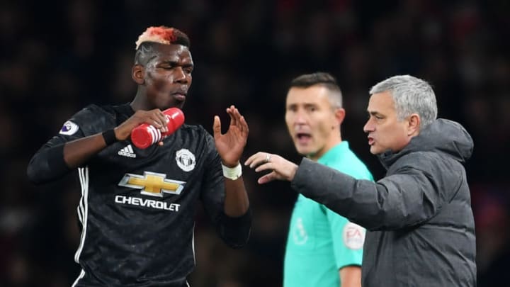 LONDON, ENGLAND - DECEMBER 02: Jose Mourinho, Manager of Manchester United speaks to Paul Pogba of Manchester United during the Premier League match between Arsenal and Manchester United at Emirates Stadium on December 2, 2017 in London, England. (Photo by Laurence Griffiths/Getty Images)