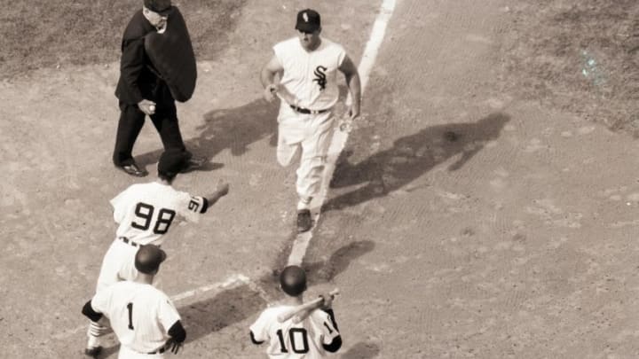 CHICAGO, IL - OCTOBER 1959: Ted Kluszewski #8 of the Chicago White Sox on his way to home plate after hitting a home run against the Los Angeles Dodgers during Game 1 of the 1959 World Series on October 1, 1959 in Chicago, Illinois. (Photo by Herb Scharfman/Sports Imagery/Getty Images)