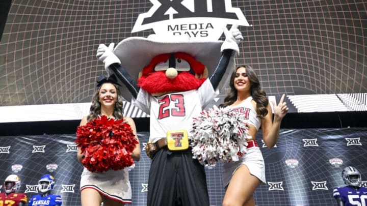 Jul 13, 2023; Arlington, TX, USA; The Texas Tech Red Raiders mascot and cheerleaders pose for a photo before the start of the Big 12 football media day at AT&T Stadium. Mandatory Credit: Jerome Miron-USA TODAY Sports