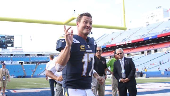 BUFFALO, NY - SEPTEMBER 16: Philip Rivers #17 of the Los Angeles Chargers runs off the field after their victory during NFL game action against the Buffalo Bills at New Era Field on September 16, 2018 in Buffalo, New York. (Photo by Tom Szczerbowski/Getty Images)