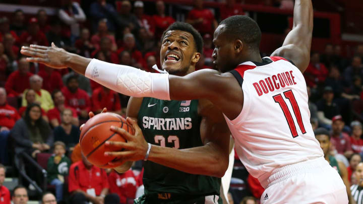 PISCATAWAY, NJ – NOVEMBER 30: Xavier Tillman #23 of the Michigan State Spartans attempts to drive to the basket as Mamadou Doucoure #11 of the Rutgers Scarlet Knights defends during the first half of a college basketball game at the Rutgers Athletic Center on November 30, 2018 in Piscataway, New Jersey. (Photo by Rich Schultz/Getty Images,)