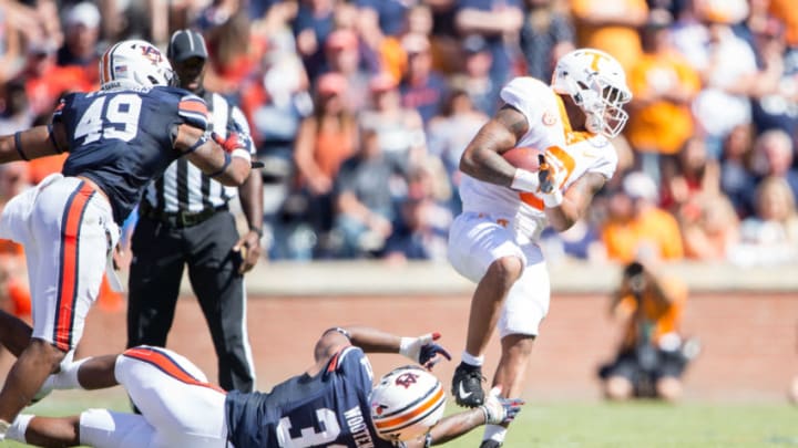 AUBURN, AL - OCTOBER 13: Linebacker Chandler Wooten #31 of the Auburn Tigers attempts to tackle running back Tim Jordan #9 of the Tennessee Volunteers during the second quarter at Jordan-Hare Stadium on October 13, 2018 in Auburn, Alabama. (Photo by Michael Chang/Getty Images)