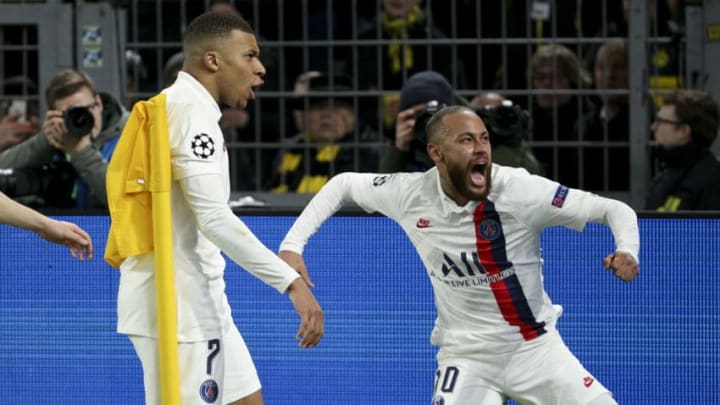 DORTMUND, GERMANY - FEBRUARY 18: Neymar Jr of PSG celebrates his goal with Kylian Mbappe (left) during the UEFA Champions League round of 16 first leg match between Borussia Dortmund and Paris Saint-Germain (PSG) at Signal Iduna Park on February 18, 2020 in Dortmund, Germany. (Photo by Jean Catuffe/Getty Images)