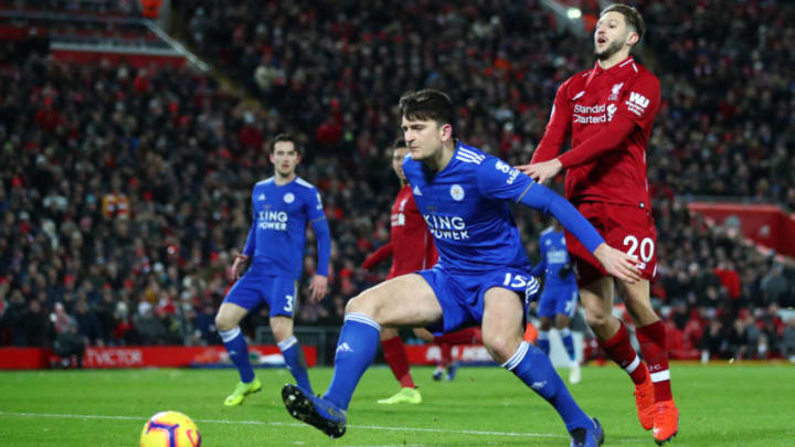 LIVERPOOL, ENGLAND - JANUARY 30: Harry Maguire of Leicester City shields the ball from Adam Lallana of Liverpool during the Premier League match between Liverpool FC and Leicester City at Anfield on January 30, 2019 in Liverpool, United Kingdom. (Photo by Clive Brunskill/Getty Images)