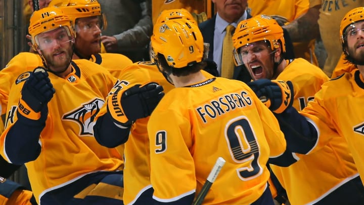 NASHVILLE, TN – APRIL 12: Mattias Ekholm #14 and Mike Fisher #12 celebrate with teammate Filip Forsberg #9 of the Nashville Predators Forsberg’s second goal of the game against the Colorado Avalanche during the third period of a 5-2 Predators victory in Game One of the Western Conference First Round during the 2018 NHL Stanley Cup Playoffs at Bridgestone Arena on April 12, 2018 in Nashville, Tennessee. (Photo by Frederick Breedon/Getty Images)