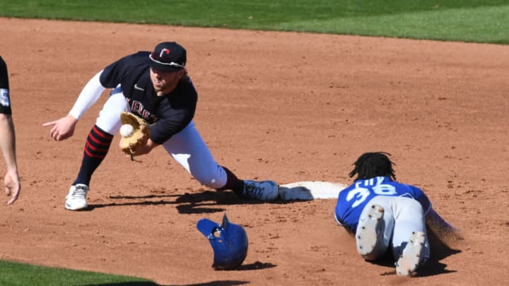 GOODYEAR, ARIZONA - MARCH 01: Owen Miller #91 of the Cleveland Indians catches a throw from catcher Beau Taylor #46 as Lucius Fox #38 of the Kansas City Royals attempts to steal second base during the fifth inning a spring training game at Goodyear Ballpark on March 01, 2021 in Goodyear, Arizona. Fox was out at second base. (Photo by Norm Hall/Getty Images)