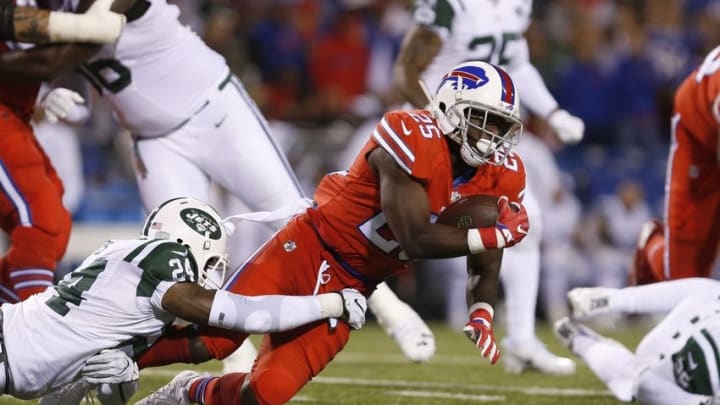 Sep 15, 2016; Orchard Park, NY, USA; New York Jets cornerback Darrelle Revis (24) makes a tackle on Buffalo Bills running back LeSean McCoy (25) during the second half at New Era Field. Mandatory Credit: Timothy T. Ludwig-USA TODAY Sports