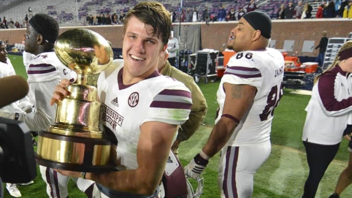 Nov 26, 2016; Oxford, MS, USA; Mississippi State Bulldogs quarterback Nick Fitzgerald (7) celebrates after the game against the Mississippi Rebels at Vaught-Hemingway Stadium. Mississippi State won 55-20 Mandatory Credit: Matt Bush-USA TODAY Sports