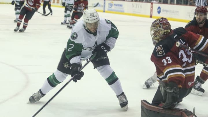 TUCSON, AZ - MAY 02: Texas Stars right wing Colin Markison (12) tries to get the puck past Tucson Roadrunners goaltender Adin Hill (33) during a hockey game between the Texas Stars and Tuscon Roadrunners on May 02, 2018, at Tucson Convention Center in Tucson, AZ. (Photo by Jacob Snow/Icon Sportswire via Getty Images)