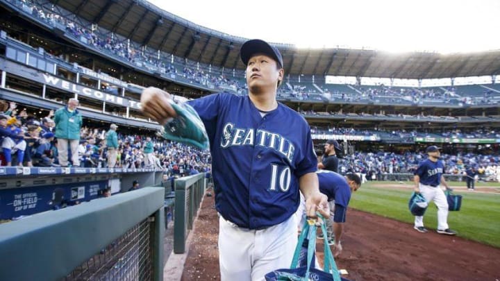Oct 2, 2016; Seattle, WA, USA; Seattle Mariners first baseman Dae-Ho Lee (10) throws out souvenirs for fans after the last game against the Oakland Athletics at Safeco Field. Oakland won 3-2. Mandatory Credit: Jennifer Buchanan-USA TODAY Sports