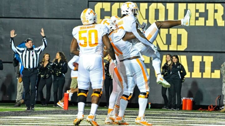 NASHVILLE, TN - NOVEMBER 26: Alvin Kamara #6 of the University of Tennessee Volunteers is congratulated by teammates Venzell Boulware #50 and Kenny Bynum #51 after scoring a touchdown against the Vanderbilt Commodores during the first half at Vanderbilt Stadium on November 26, 2016 in Nashville, Tennessee. (Photo by Frederick Breedon/Getty Images)