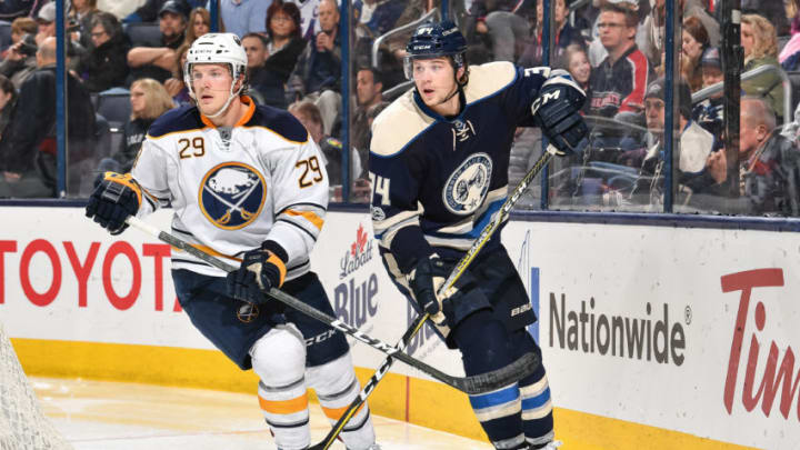 COLUMBUS, OH - MARCH 28: Jake McCabe #29 of the Buffalo Sabres and Josh Anderson #34 of the Columbus Blue Jackets battle for position while chasing after a loose puck on March 28, 2017 at Nationwide Arena in Columbus, Ohio. Columbus defeated Buffalo 3-1. (Photo by Jamie Sabau/NHLI via Getty Images)