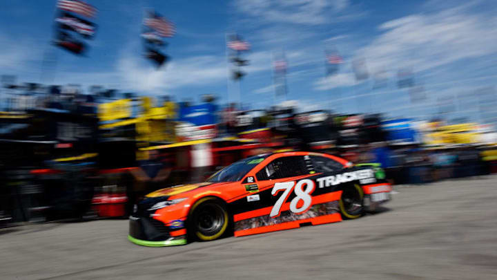 KANSAS CITY, KS - OCTOBER 20: Martin Truex Jr., driver of the #78 Bass Pro Shops/Tracker Boats Toyota, drives through the garage area during practice for the Monster Energy NASCAR Cup Series Hollywood Casino 400 at Kansas Speedway on October 20, 2017 in Kansas City, Kansas. (Photo by Jared C. Tilton/Getty Images)