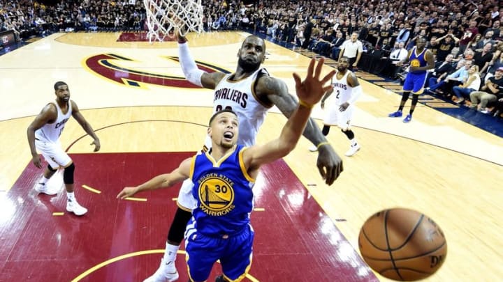 Jun 16, 2016; Cleveland, OH, USA; Cleveland Cavaliers forward LeBron James (23) blocks a shot by Golden State Warriors guard Stephen Curry (30) during the fourth quarter in game six of the NBA Finals at Quicken Loans Arena. Mandatory Credit: Bob Donnan-USA TODAY Sports
