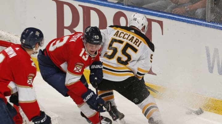 SUNRISE, FL - MARCH 23: Mark Pysyk #13 of the Florida Panthers is unable to take the puck away from Noel Acciari #55 of the Boston Bruins during third period action at the BB&T Center on March 23, 2019 in Sunrise, Florida. The Bruins defeated the Panthers 7-3. (Photo by Joel Auerbach/Getty Images)