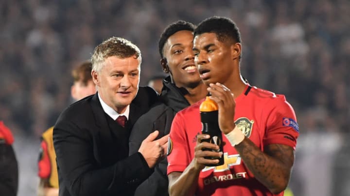 Manchester United's Norwegian manager Ole Gunnar Solskjaer (L), Manchester United's French striker Anthony Martial (C) and Manchester United's English striker Marcus Rashford gesture at the final whistle during the UEFA Europa league group L football match between Partizan Belgrade and Manchester United at the Partizan stadium in Belgrade on October 24, 2019. - Manchester United beat Partizan Belkgrade 1 - 0. (Photo by ANDREJ ISAKOVIC / AFP) (Photo by ANDREJ ISAKOVIC/AFP via Getty Images)