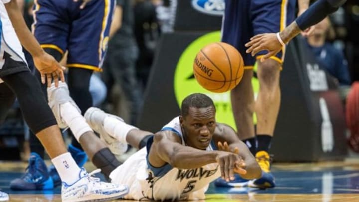 Dec 21, 2014; Minneapolis, MN, USA; Minnesota Timberwolves center Gorgui Dieng (5) passes the ball from the floor during the second half against the Indiana Pacers at Target Center. The Pacers won 100-96. Mandatory Credit: Jesse Johnson-USA TODAY Sports