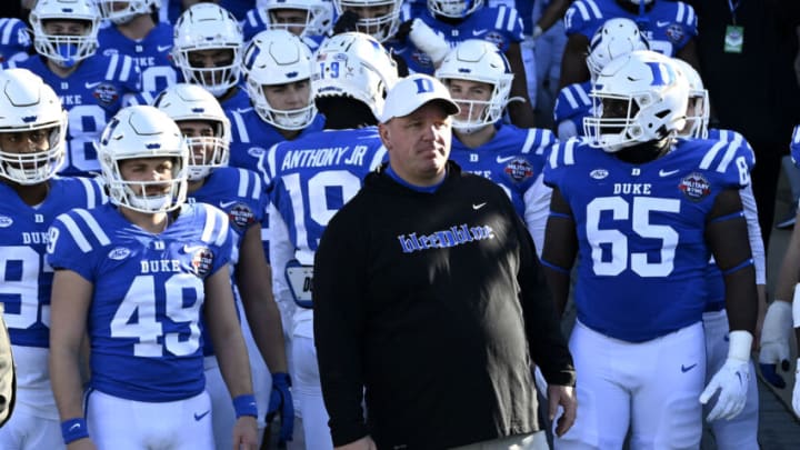 ANNAPOLIS, MARYLAND - DECEMBER 28: Head coach Mike Elko of the Duke Blue Devils leads his team onto the field before the game against the UCF Knights in the Military Bowl Presented by Peraton at Navy-Marine Corps Memorial Stadium on December 28, 2022 in Annapolis, Maryland. (Photo by G Fiume/Getty Images)