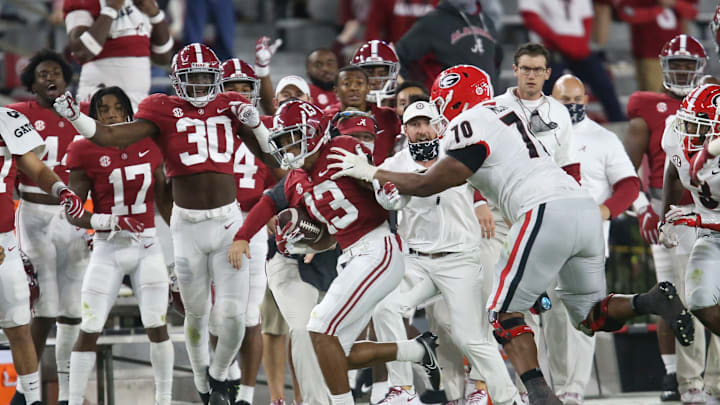 Oct 17, 2020; Tuscaloosa, Alabama, USA; Georgia offensive lineman Warren McClendon (70) forces Alabama defensive back Malachi Moore (13) out of bounds after Moore intercepted a pass during the second half of Alabama’s 41-24 win over Georgia at Bryant-Denny Stadium. Mandatory Credit: Gary Cosby Jr/The Tuscaloosa News via USA TODAY Sports