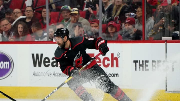 RALEIGH, NC - MAY 14: Justin Williams #14 of the Carolina Hurricanes controls the puck on the ice in Game Three of the Eastern Conference Third Round against the Boston Bruins during the 2019 NHL Stanley Cup Playoffs on May 14, 2019 at PNC Arena in Raleigh, North Carolina. (Photo by Gregg Forwerck/NHLI via Getty Images)