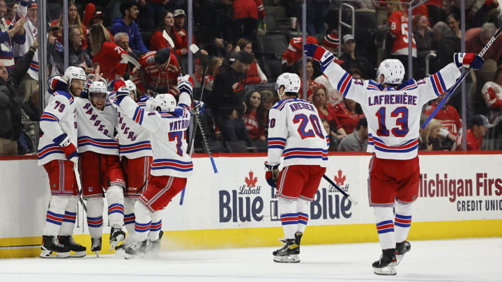 Mar 30, 2022; Detroit, Michigan, USA; New York Rangers center Andrew Copp (18) celebrates with teammates after scoring in overtime against the Detroit Red Wings at Little Caesars Arena. Mandatory Credit: Rick Osentoski-USA TODAY Sports