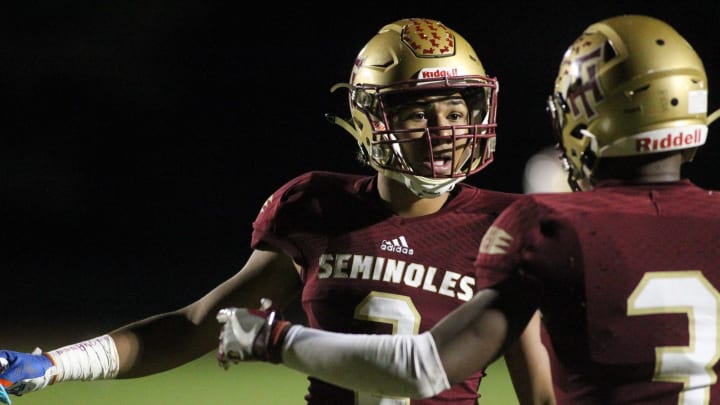 Florida High sophomore defensive back Tre Donaldson talks coverage with Ahmari Harvey as Florida High beat Leon 47-10 on Nov. 1, 2019.A45c2009