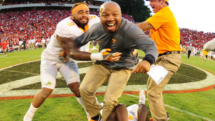 ATHENS, GA - OCTOBER 1: Assistant Coach Robert Gillespie of the Tennessee Volunteers celebrates with Justin Martin