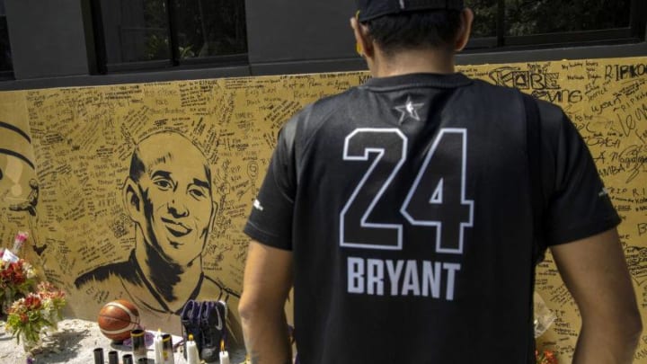 VALENZUELA, PHILIPPINES - JANUARY 28: A basketball fan looks on at a mural of former NBA star Kobe Bryant outside the "House of Kobe" basketball court on January 28, 2020 in Valenzuela, Metro Manila, Philippines. Bryant, who is hugely popular in basketball-obsessed Philippines, perished in a helicopter crash on January 26, 2020 in Calabasas, California. He died together with his 13-year-old daughter Gianna and seven others. (Photo by Ezra Acayan/Getty Images)