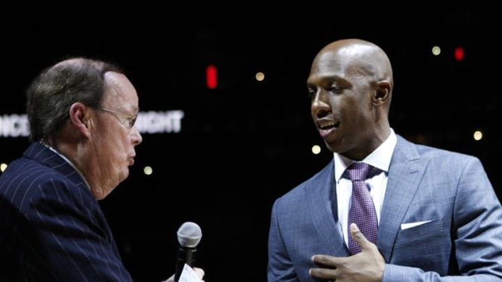 Feb 10, 2016; Auburn Hills, MI, USA; Chauncey Billups (right) shakes hands with television and radio play by play announcer George Blaha during the halftime retirement ceremony in the game between the Detroit Pistons and the Denver Nuggets at The Palace of Auburn Hills. Mandatory Credit: Raj Mehta-USA TODAY Sports