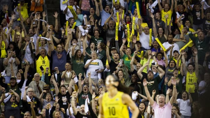 SEATTLE, WA - SEPTEMBER 09: Seattle Storm fans erupt after Sue Bird #10 of the Seattle Storm hit a three-pointer from over 30 feet away against the Washington Mystics during the second half of Game 2 of the WNBA Finals at KeyArena on September 9, 2018 in Seattle, Washington. The Seattle Storm beat the Washington Mystics 75-73. (Photo by Lindsey Wasson/Getty Images)