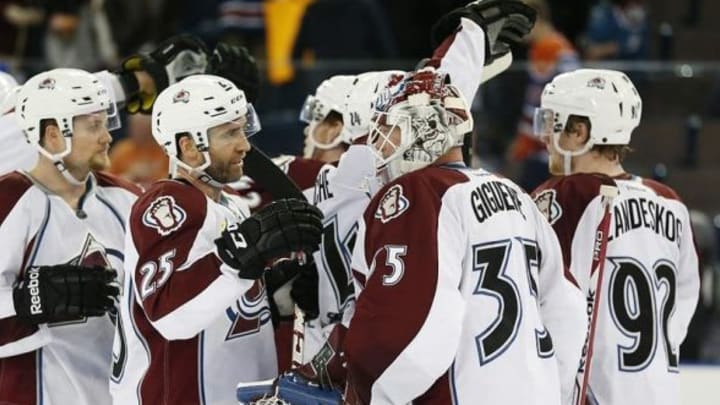 Apr 8, 2014; Edmonton, Alberta, CAN; The Colorado Avalanche celebrate with goaltender Jean-Sebastien Giguere (35) after beating the Edmonton Oilers 4-1 at Rexall Place. Mandatory Credit: Perry Nelson-USA TODAY Sports