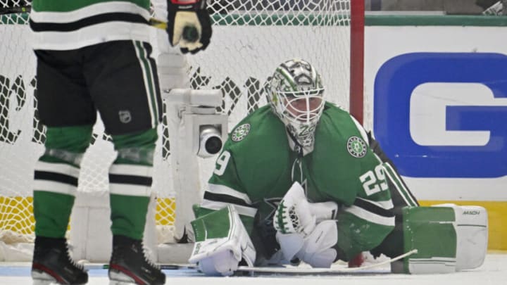 Apr 17, 2023; Dallas, Texas, USA; Dallas Stars goaltender Jake Oettinger (29) makes a save on a Minnesota Wild shot during the first overtime period in game one of the first round of the 2023 Stanley Cup Playoffs at the American Airlines Center. Mandatory Credit: Jerome Miron-USA TODAY Sports