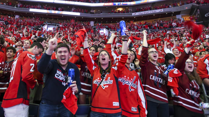 WASHINGTON, DC – JUNE 07: Fans celebrate after a goal by the Washington Capitals on June 7, 2018, at the Capital One Arena in Washington, D.C. in Game 5 of the Stanley Cup Playoffs. The Washington Capitals defeated the Vegas Golden Knights. 4-3 to win the Stanley Cup. (Photo by Mark Goldman/Icon Sportswire via Getty Images)