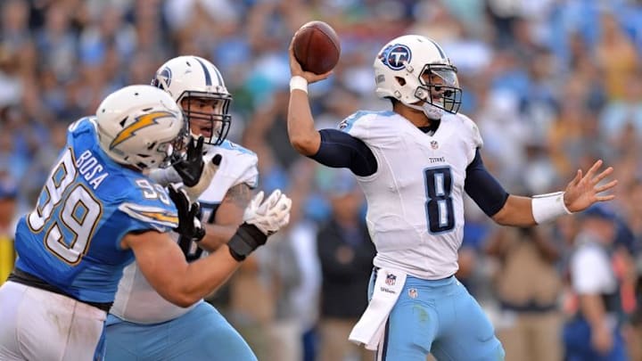 Nov 6, 2016; San Diego, CA, USA; Tennessee Titans quarterback Marcus Mariota (8) looks to pass as offensive tackle Jack Conklin (78) blocks San Diego Chargers defensive end Joey Bosa (99) during the fourth quarter at Qualcomm Stadium. Mandatory Credit: Jake Roth-USA TODAY Sports