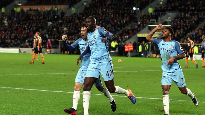 HULL, ENGLAND – DECEMBER 26: Yaya Toure of Manchester City celebrates scoring the opening goal with David Silva and Raheem Sterling during the Premier League match between Hull City and Manchester City at KCOM Stadium on December 26, 2016 in Hull, England. (Photo by Nigel Roddis/Getty Images)