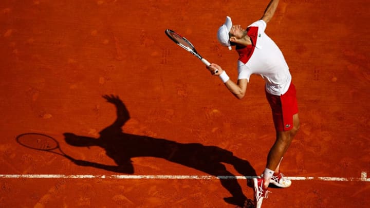 MONTE-CARLO, MONACO - APRIL 19: Novak Djokovic of Serbia serves against Dominic Thiem of Austria during his men's singles 3rd round match on day five of the Rolex Monte-Carlo Masters at Monte-Carlo Sporting Club on April 19, 2018 in Monte-Carlo, Monaco. (Photo by Julian Finney/Getty Images)