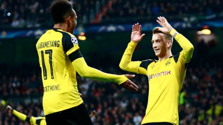 MADRID, SPAIN – DECEMBER 07: Marco Reus of Borussia Dortmund (R) celebrates scoring his sides second goal with Pierre-Emerick Aubameyang of Borussia Dortmund (L) during the UEFA Champions League Group F match between Real Madrid CF and Borussia Dortmund at the Bernabeu on December 7, 2016 in Madrid, Spain. (Photo by Gonzalo Arroyo Moreno/Getty Images)