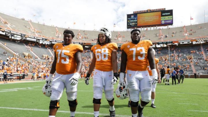 KNOXVILLE, TN - SEPTEMBER 15: Offensive lineman Jerome Carvin #75 of the Tennessee Volunteers, Offensive lineman Marcus Tatum #68 of the Tennessee Volunteers , and Offensive lineman Trey Smith #73 of the Tennessee Volunteers walk to the locker room after the game between the UTEP Miners and Tennessee Volunteers at Neyland Stadium on September 15, 2018 in Knoxville, Tennessee. Tennessee won the game 24-0. (Photo by Donald Page/Getty Images)