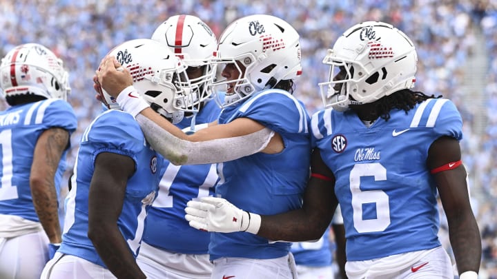 Oct 15, 2022; Oxford, Mississippi, USA; Mississippi Rebels wide receiver Dayton Wade (19) reacts with quarterback Jaxson Dart (2) and running back Zach Evans (6) after a touchdown against the Auburn Tigers during the first quarter at Vaught-Hemingway Stadium. Mandatory Credit: Matt Bush-USA TODAY Sports