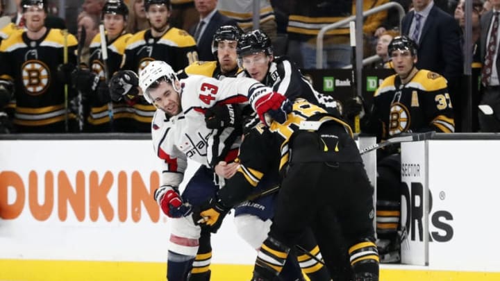 BOSTON, MA - DECEMBER 23: Washington Capitals right wing Tom Wilson (43) goes after Boston Bruins right wing David Pastrnak (88) as linesman Ryan Daisy (81) moves in during a game between the Boston Bruins and the Washington Capitals on December 23, 2019 at TD Garden in Boston, Massachusetts. (Photo by Fred Kfoury III/Icon Sportswire via Getty Images)