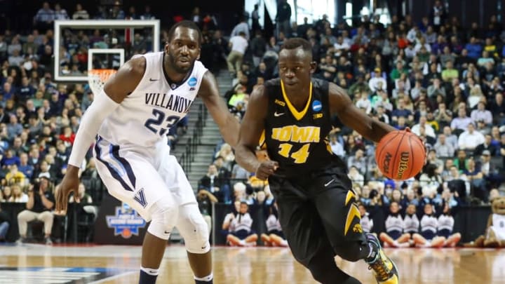 Mar 20, 2016; Brooklyn, NY, USA; Iowa Hawkeyes guard Peter Jok (14) dribbles past Villanova Wildcats forward Daniel Ochefu (23) during the second half in the second round of the 2016 NCAA Tournament at Barclays Center. Mandatory Credit: Anthony Gruppuso-USA TODAY Sports