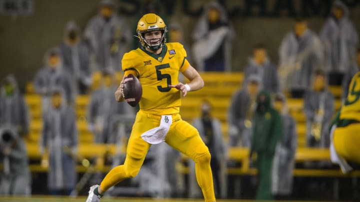 Nov 28, 2020; Waco, Texas, USA; Baylor Bears quarterback Charlie Brewer (5) rolls out against the Kansas State Wildcats during the first quarter at McLane Stadium. Mandatory Credit: Jerome Miron-USA TODAY Sports