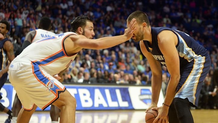 Oct 13, 2016; Tulsa, OK, USA; Oklahoma City Thunder center Joffrey Lauvergne (77) accidentally pokes Memphis Grizzlies center Marc Gasol (33) in the eye during the second quarter at BOK Center. Mandatory Credit: Mark D. Smith-USA TODAY Sports