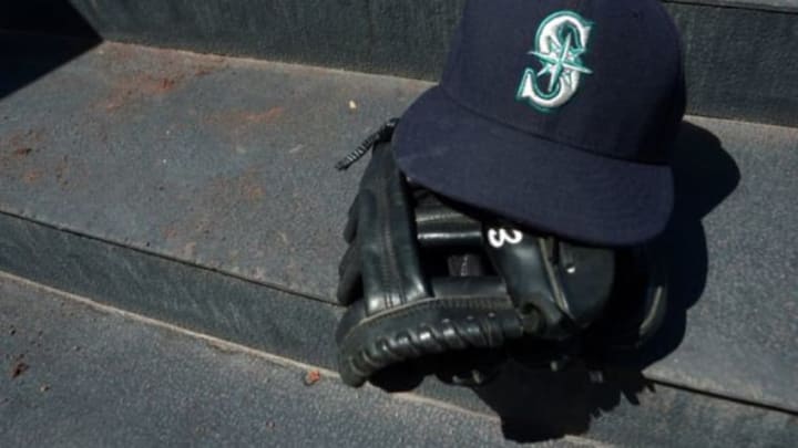 Jun 19, 2014; San Diego, CA, USA; A detailed view a of a Seattle Mariners glove and hat before a game against the San Diego Padres at Petco Park. Mandatory Credit: Jake Roth-USA TODAY Sports