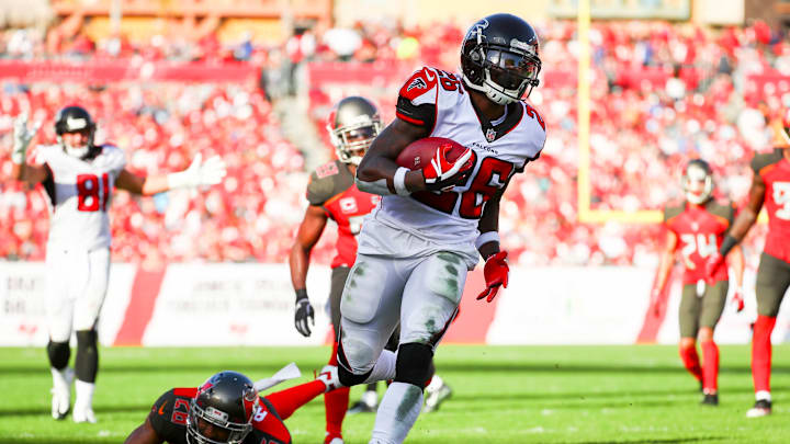 TAMPA, FL – DECEMBER 30: Running back Tevin Coleman #26 of the Atlanta Falcons breaks a tackle attempt by defensive back Andrew Adams #26 of the Tampa Bay Buccaneers on his way to score in the third quarter of the game at Raymond James Stadium on December 30, 2018 in Tampa, Florida. (Photo by Will Vragovic/Getty Images)