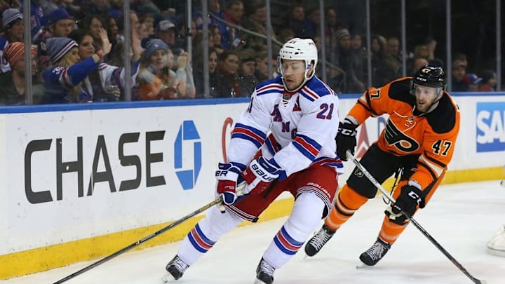 Feb 14, 2016; New York, NY, USA; New York Rangers center Derek Stepan (21) carries as Philadelphia Flyers defender Andrew MacDonald (47) follows during the second period at Madison Square Garden. Mandatory Credit: Anthony Gruppuso-USA TODAY Sports