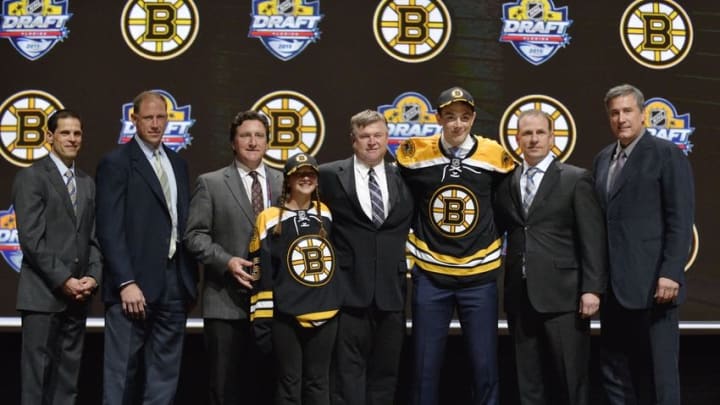 Jun 26, 2015; Sunrise, FL, USA; Zachary Senyshyn poses for a photo with team executives after being selected as the number fifteen overall pick to the Boston Bruins in the first round of the 2015 NHL Draft at BB&T Center. Mandatory Credit: Steve Mitchell-USA TODAY Sports